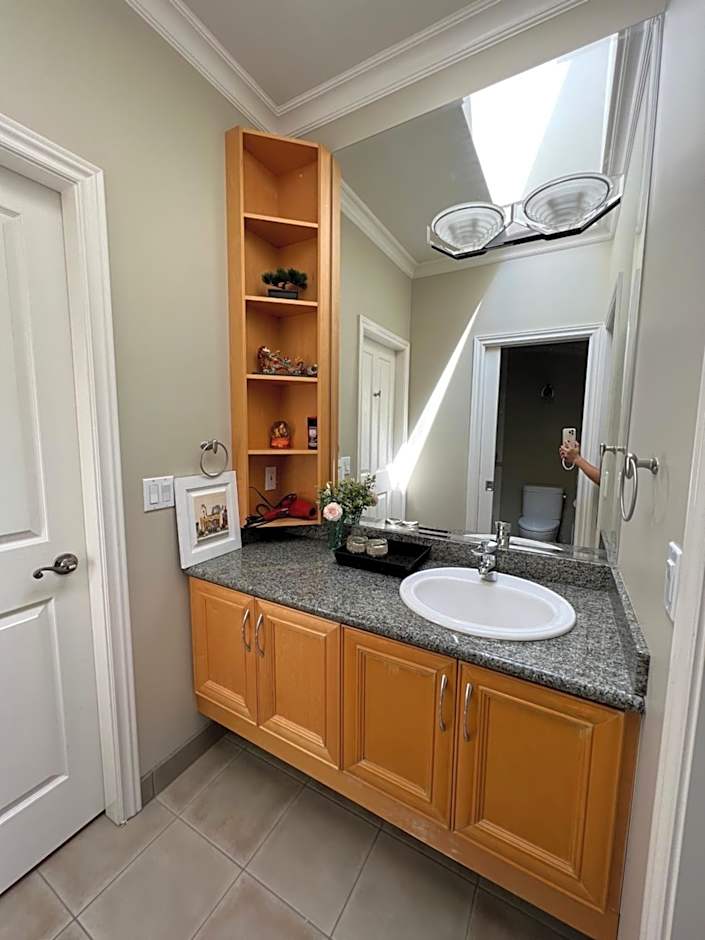 A cozy bedroom with a private washroom close to YVR Richmond