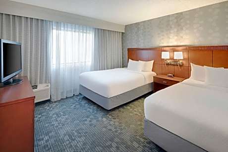 One-Bedroom Suite with Two Double Beds and Sofa Bed - Courtyard View