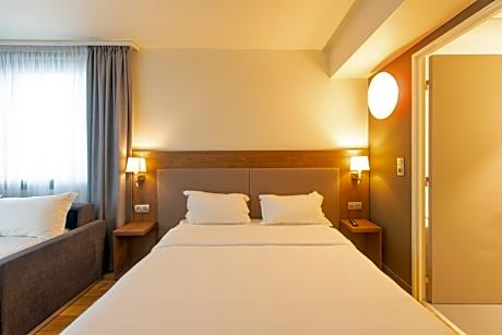 Quadruple Room with One Sofa Bed and One Double Bed