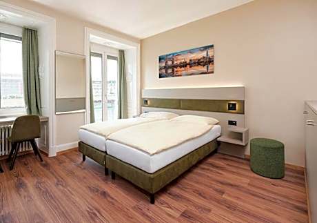 Comfort Twin Room facing the Chapel Bridge