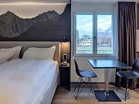 Air-conditioned family studio, 1 large bed, living area with kitchen