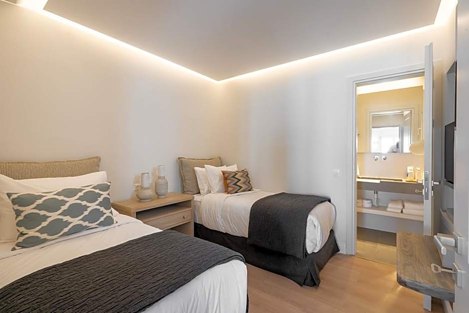 NĒRO Suites by NOMÉE Hospitality Group