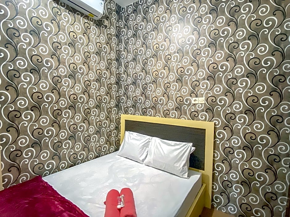 Tini's Guest House Malang Mitra RedDoorz