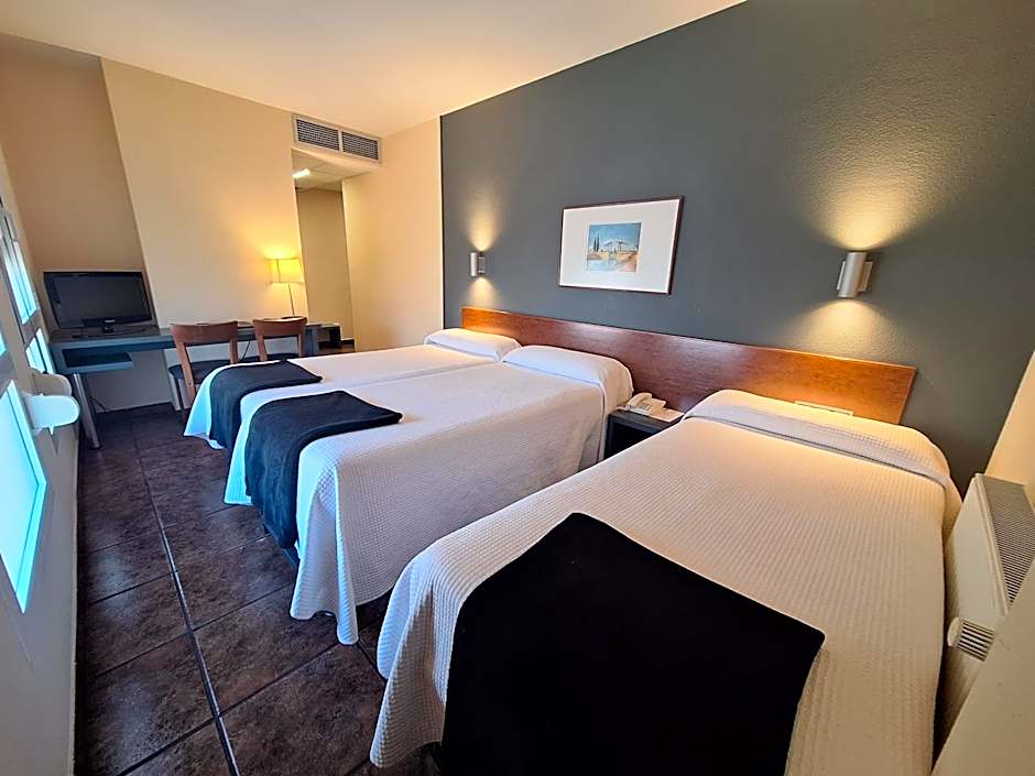 Photo 1 of 7 of Triple Room