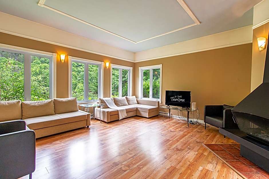 Tranquil Riverfront Chalet with Hot Tub