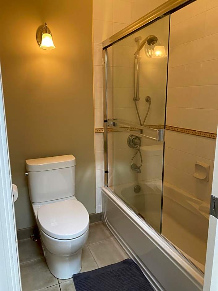 A cozy bedroom with a private washroom close to YVR Richmond