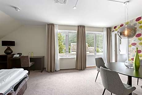 Junior King Suite with Sofa Bed, Balcony and Sea View
