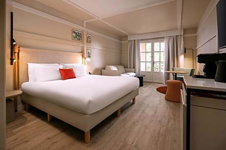 Junior King Suite with Sofa Bed, Balcony and Garden View
