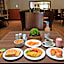 Hotel Windsor House Inn By GEH Suites