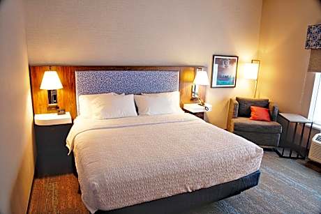 King Bed Room With Microwave And Fridge