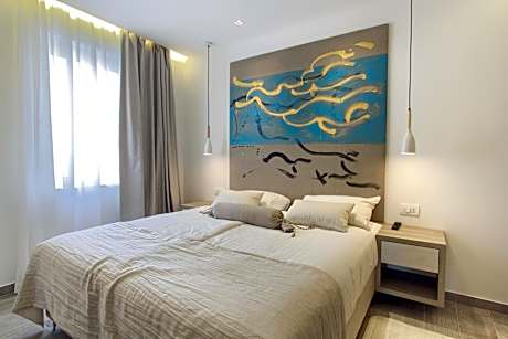 Two-Bedroom Suite with Balcony and Sea View