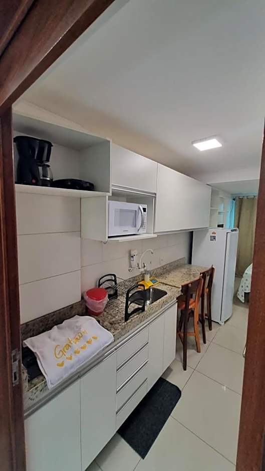 Confortável Flat com piscina de borda infinita na cobertura