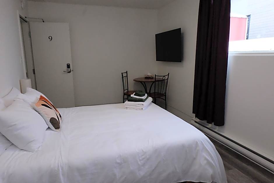Photo 1 of 11 of Queen Room with Shared Bathroom
