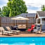 vacation house with a heated pool and hot tub
