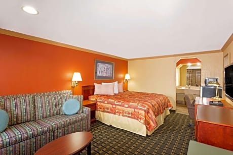 1 King Bed Smoking Room With Free Continental Breakfast, Free Wi-Fi, Refrigerator And Microwave