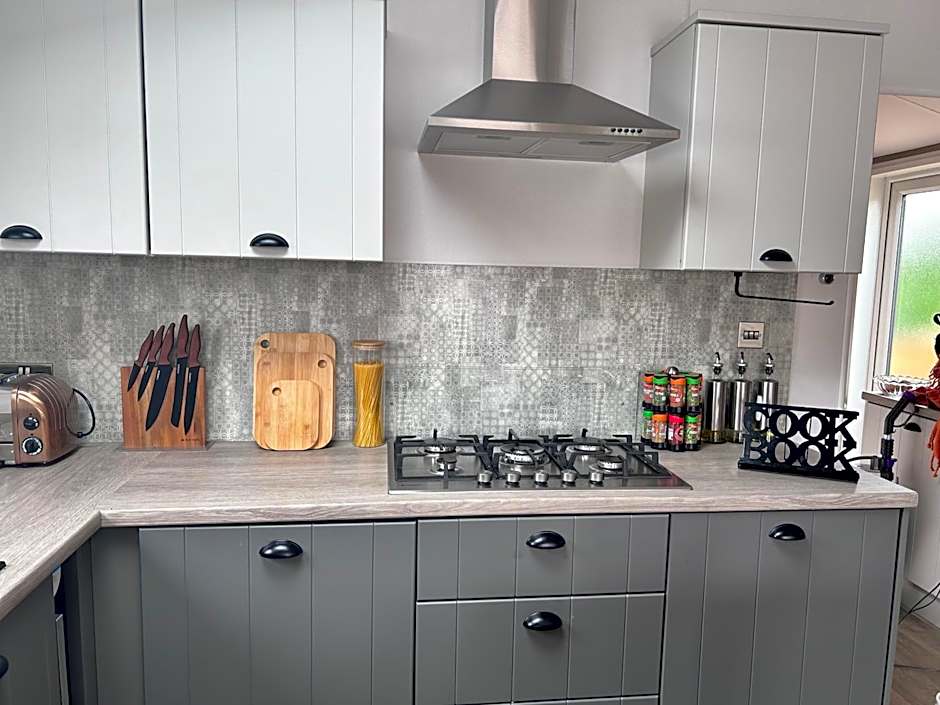 Award winning Serenity Lodge with outstanding lakeside views from the hot tub , at Tallington Lakes Leisure Park, Stamford