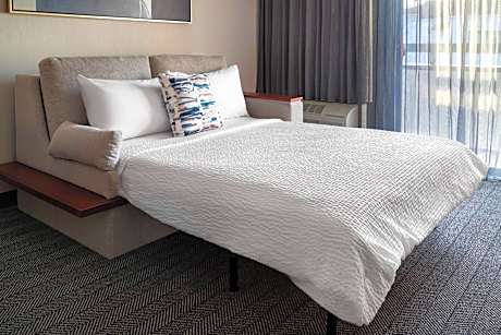One-Bedroom King Suite with Sofa Bed, Adapted Tub and Balcony - Mobility and Hearing Accessible