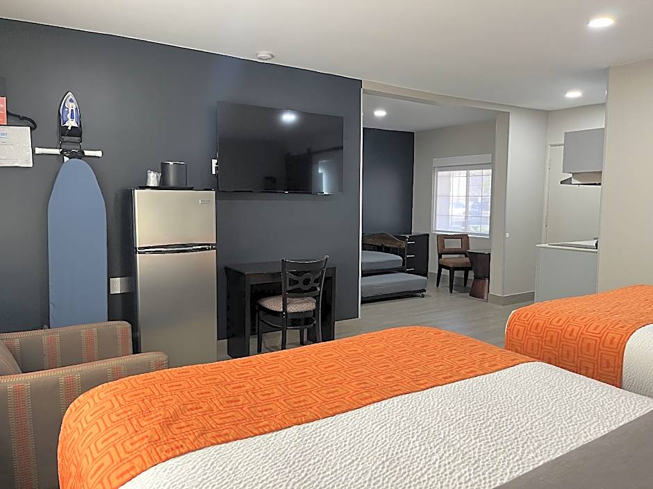 Photo 1 of 7 of 2 Queen Beds, 2 Twin Beds, Family Suite, Kitchenette, Non-Smoking