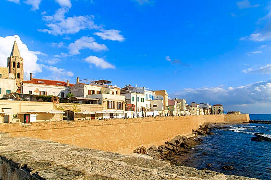 ClickSardinia Alghero Spectacular waterfront Neptune apartment with sea-facing terraces and garden