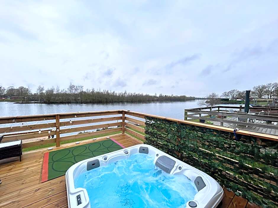 Award winning Serenity Lodge with outstanding lakeside views from the hot tub , at Tallington Lakes Leisure Park, Stamford