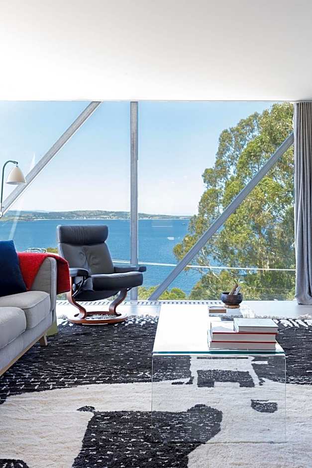 Architectural glass house with ocean views