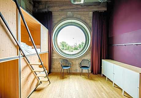 One Bedroom with four single beds and shared Bathroom