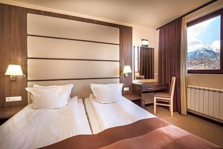Economy room with a shared balcony