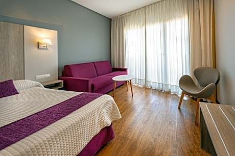 DELUXE ROOM WITH POOL VIEW AND BALCONY (2 ADULTS + 1 CHILD)