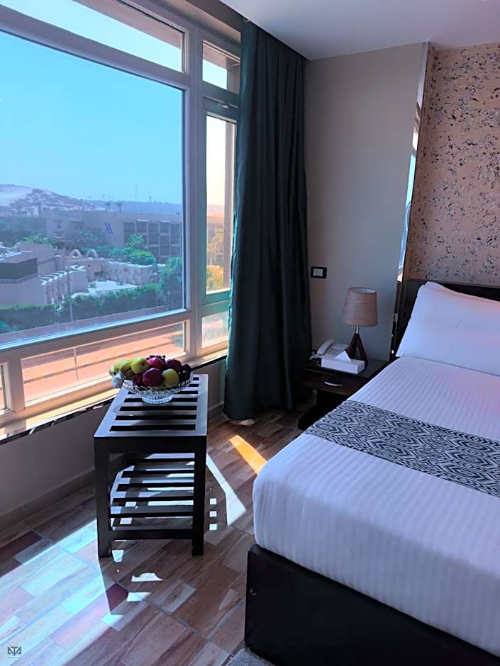 Turquoise Pyramids & Grand Egyptian museum view Hotel