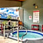 Rocky Mountain Getaway with Outdoor Heated Pool, 3 Hot Tubs, Gym, BBQ, Garage & 24 hour Reception near Banff