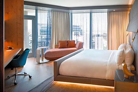 Corner King Guest Room with Balcony and Partial Bay View