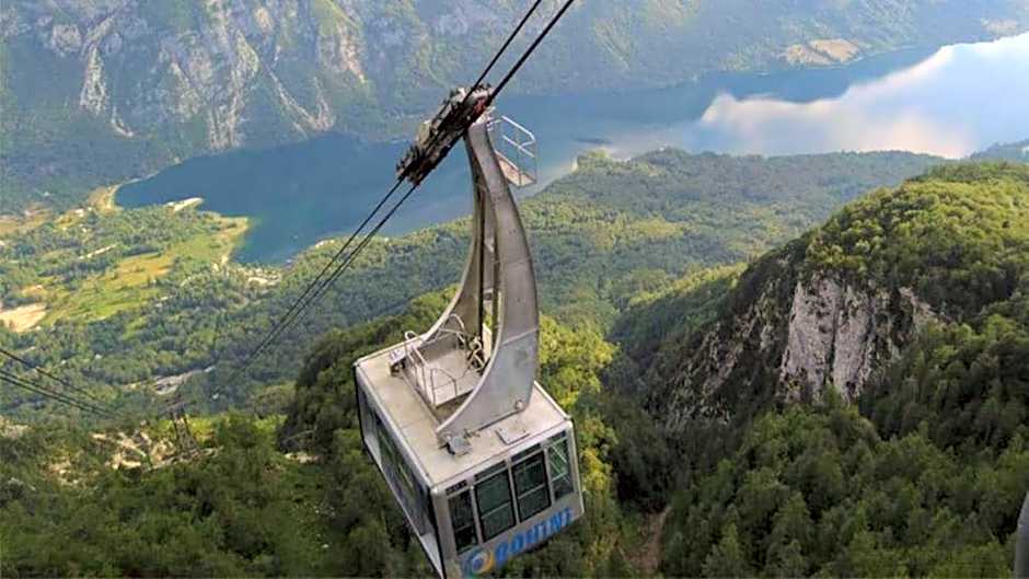 Fully equipped SIX BEDROOM HOUSE 15 kilometers from Lake Bled - with a terrace, garden, playground, and parking