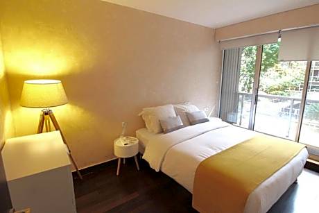 Deluxe One-Bedroom Apartment with Garden View