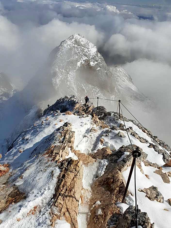 Fully equipped SIX BEDROOM HOUSE 15 kilometers from Lake Bled - with a terrace, garden, playground, and parking