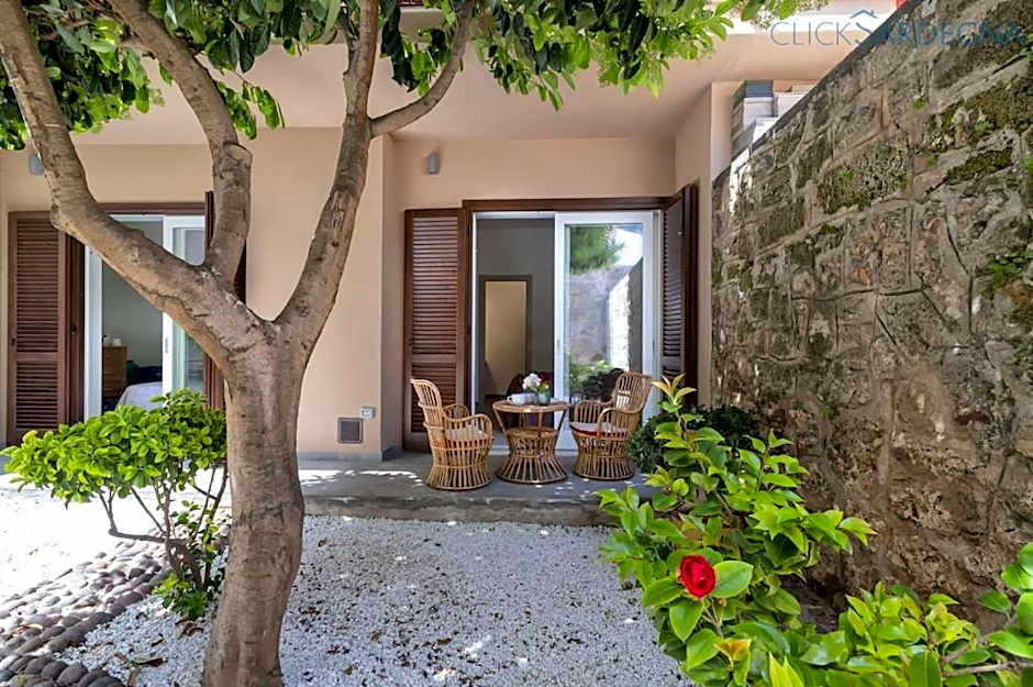 ClickSardinia Alghero Spectacular waterfront Neptune apartment with sea-facing terraces and garden