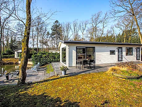 Modern chalet with two terraces and near a pond