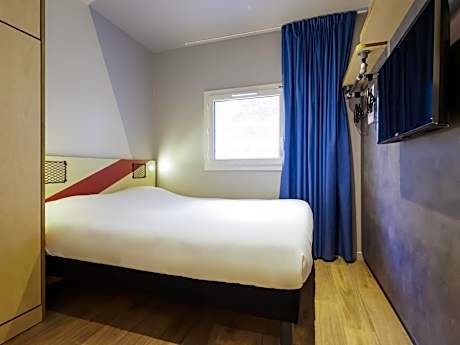 Room with One Queen Bed and an armoire bed