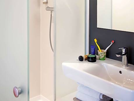 Standard Room with 2 single beds and a bunk bed (bunk bed is unmade)