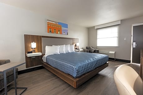 Suite-1 King Bed, Non-Smoking, Larger Room, Floor To Ceiling Windows, Work Desk, Microwave And Mini-Refrigerator, Air-Conditioned, Continental Breakfast