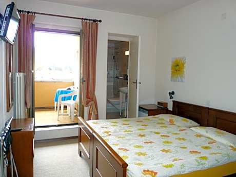 Double or Twin Room with Balcony and Garden View