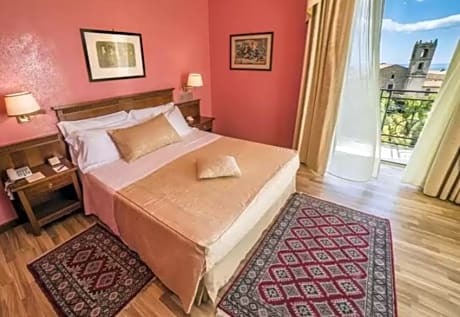 Double Single Use Deluxe with balcony, front view of Mount Etna and side view of Naxos Bay