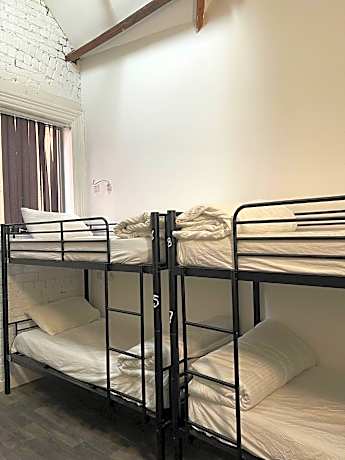 Bed in 14-bed Male Dormitory Room