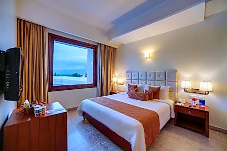Suite Room - King Size Bed with Complimentary tea/coffee service for all our in-house guest at the poolside with some popular evening snacks of Siliguri from 5pm to 7pm