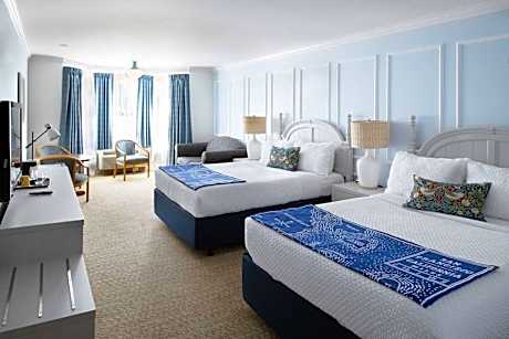 Two Queen Beds With A Loveseat Room