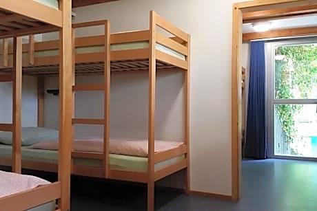 Single Bed in Dormitory Room