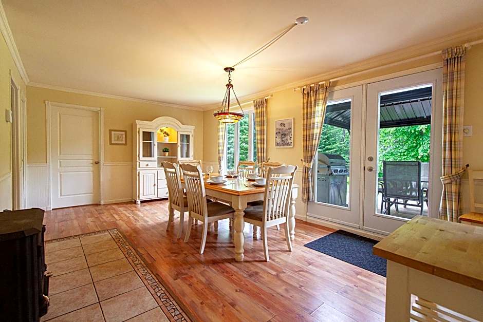 Tranquil Riverfront Chalet with Hot Tub