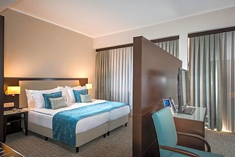 Junior Suite with Balcony and City View