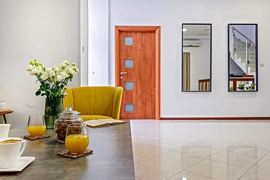 Yellow house with private parking