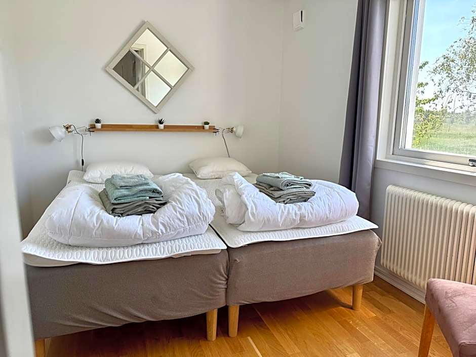 Comfortable guest rooms with fully equipped kitchen and cosy living room.