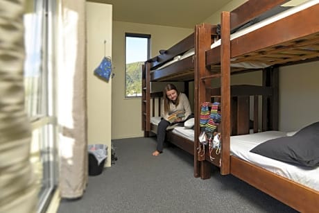 Bed in 6-Bed Dormitory Room with Shared Bathroom